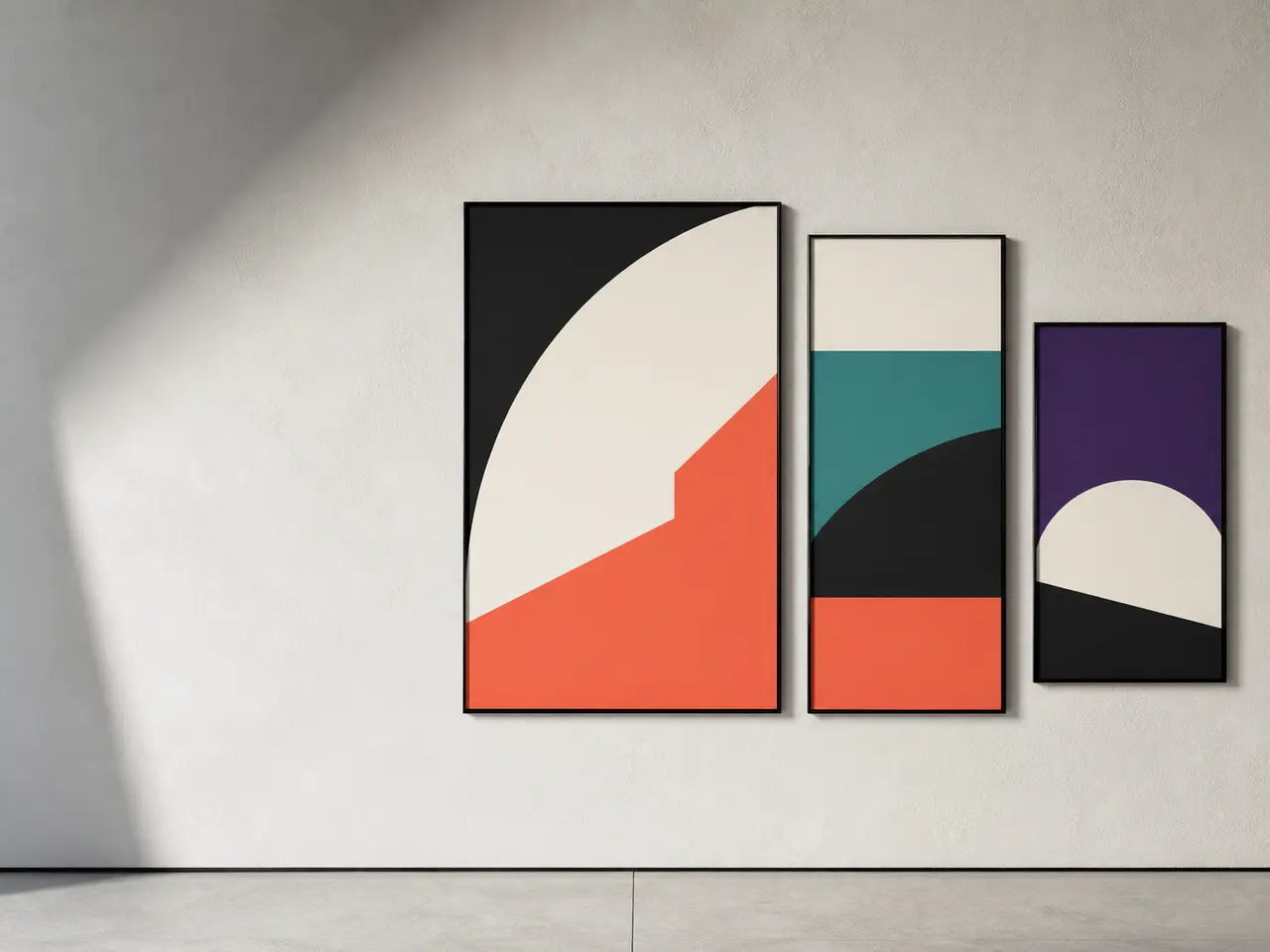 Three bold geometric fictional posters installed on a clean gallery wall