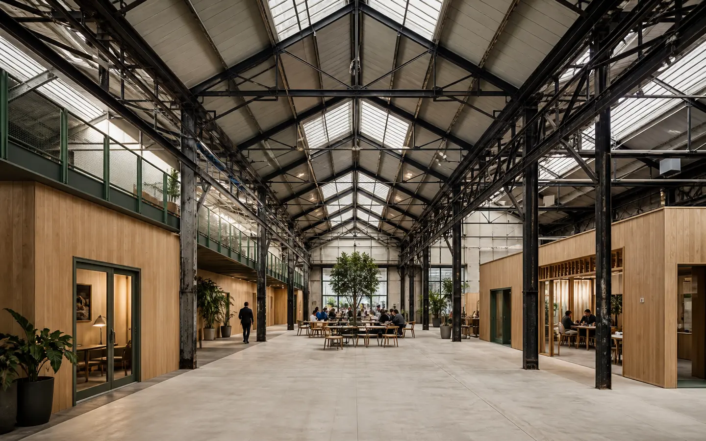 Reused fictional industrial shed with retained structural bays and reversible timber work volumes
