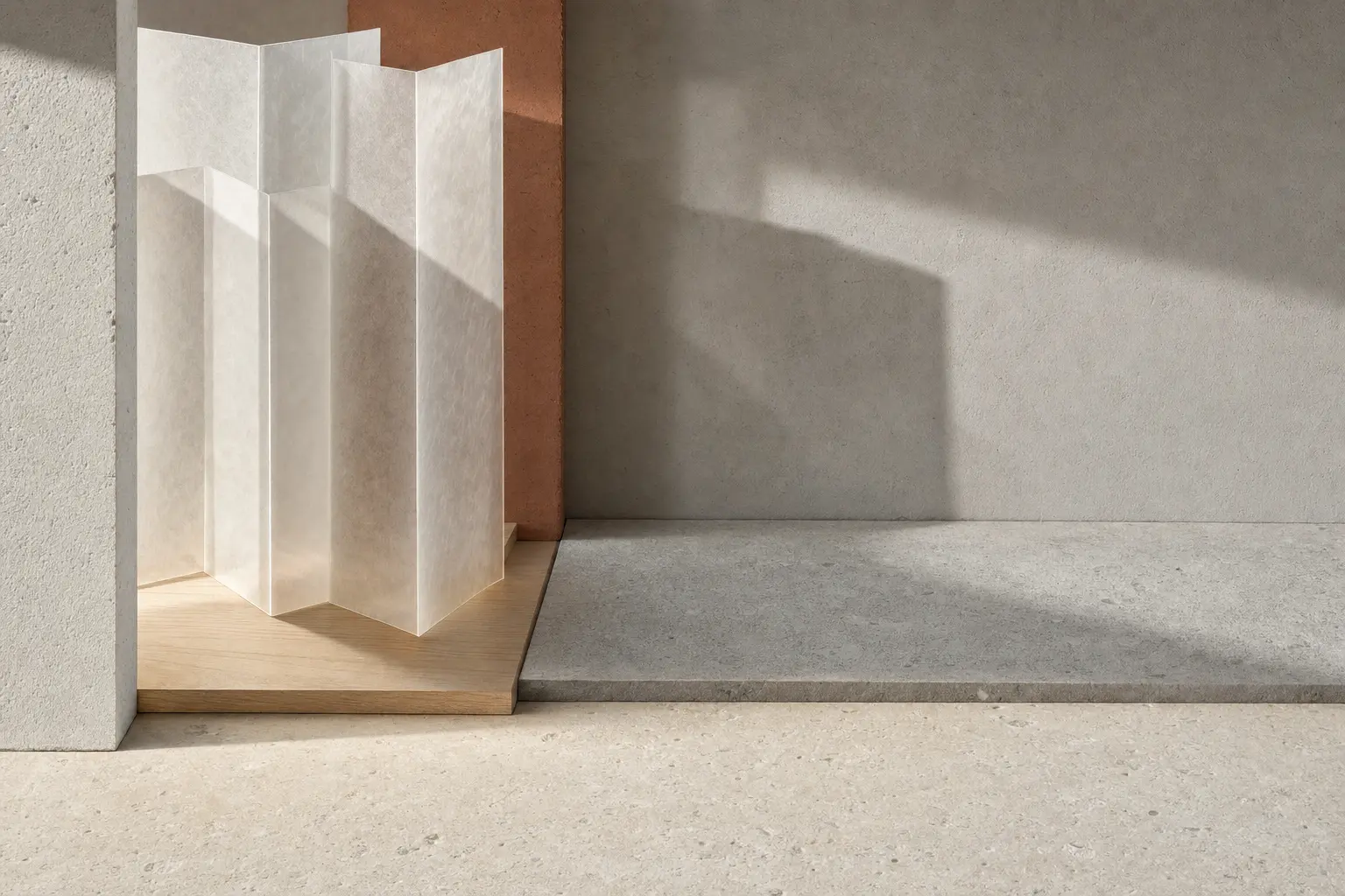 Folded translucent screens casting layered shadows on a mineral surface.