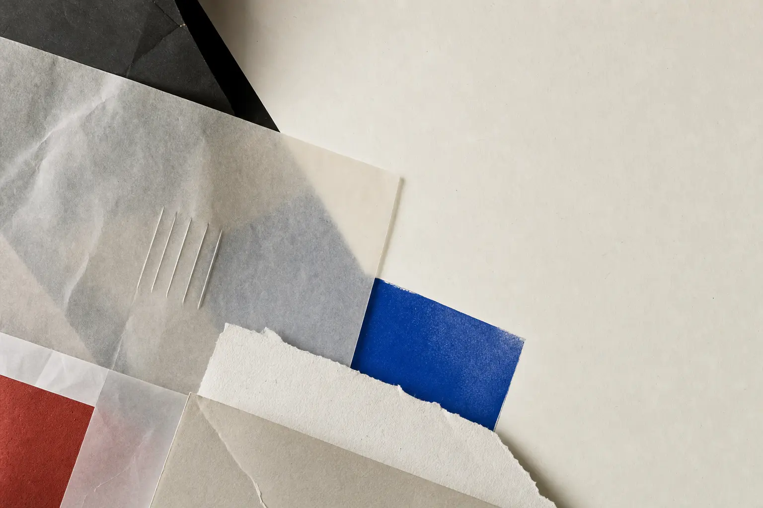 Layered translucent papers crossed by one cobalt painted bar.