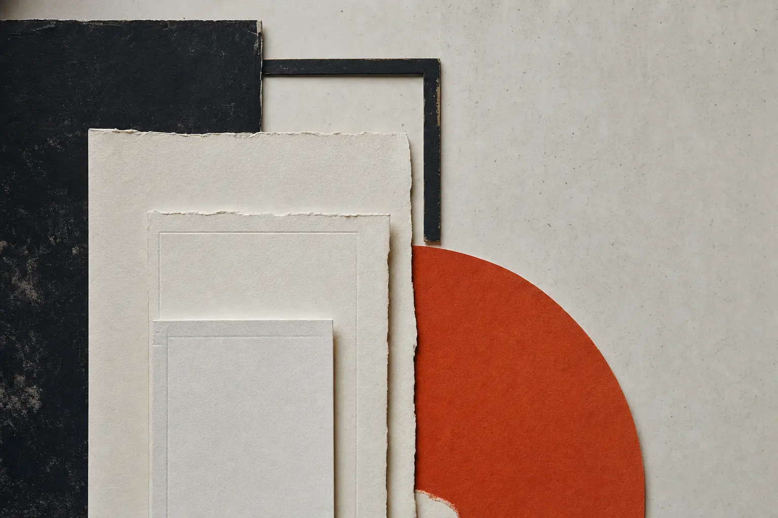 Nested deckled paper rectangles beside a red semicircle on black.